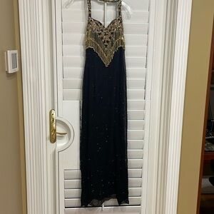 Landa size 10 100% Silk Black Gown accented with black and gold sequins.